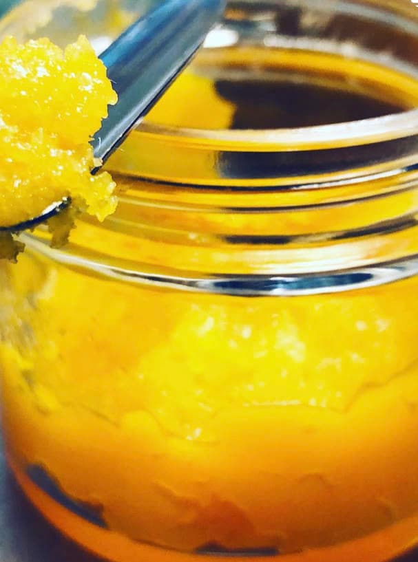 Yellow cannabis concentrate texture with dab tool — Waseca MN cannabis extraction facility